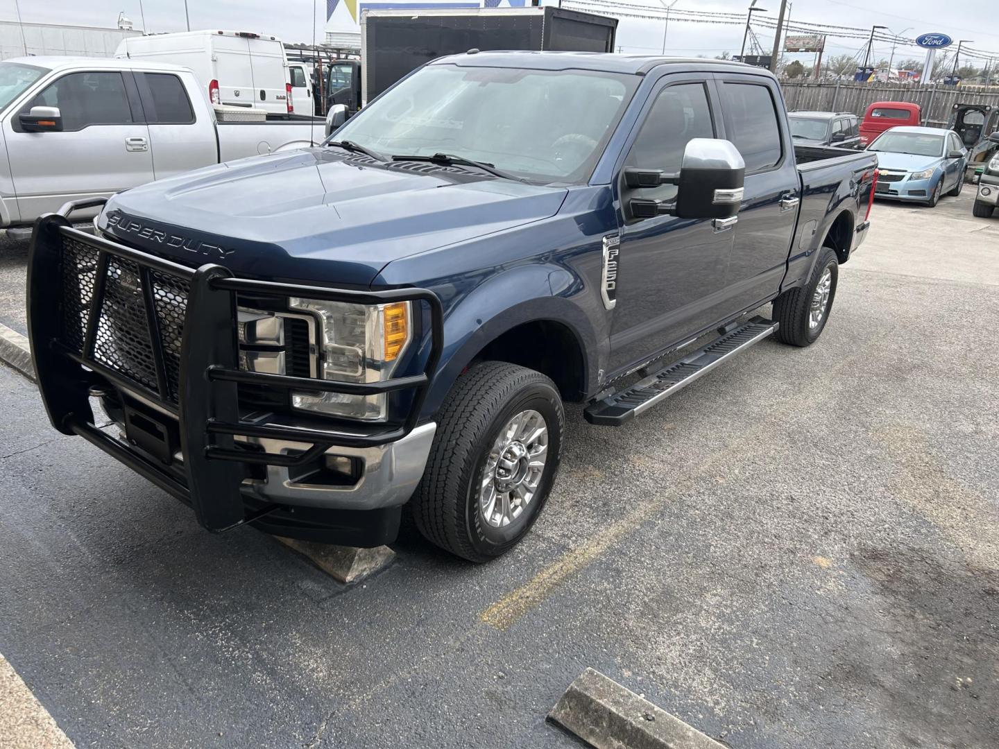 2017 Blue Ford F-250 SD XLT Crew Cab 4WD (1FT7W2B65HE) with an 6.2L V8 OHV 16V engine, 6A transmission, located at 1687 Business 35 S, New Braunfels, TX, 78130, (830) 625-7159, 29.655487, -98.051491 - Photo#0