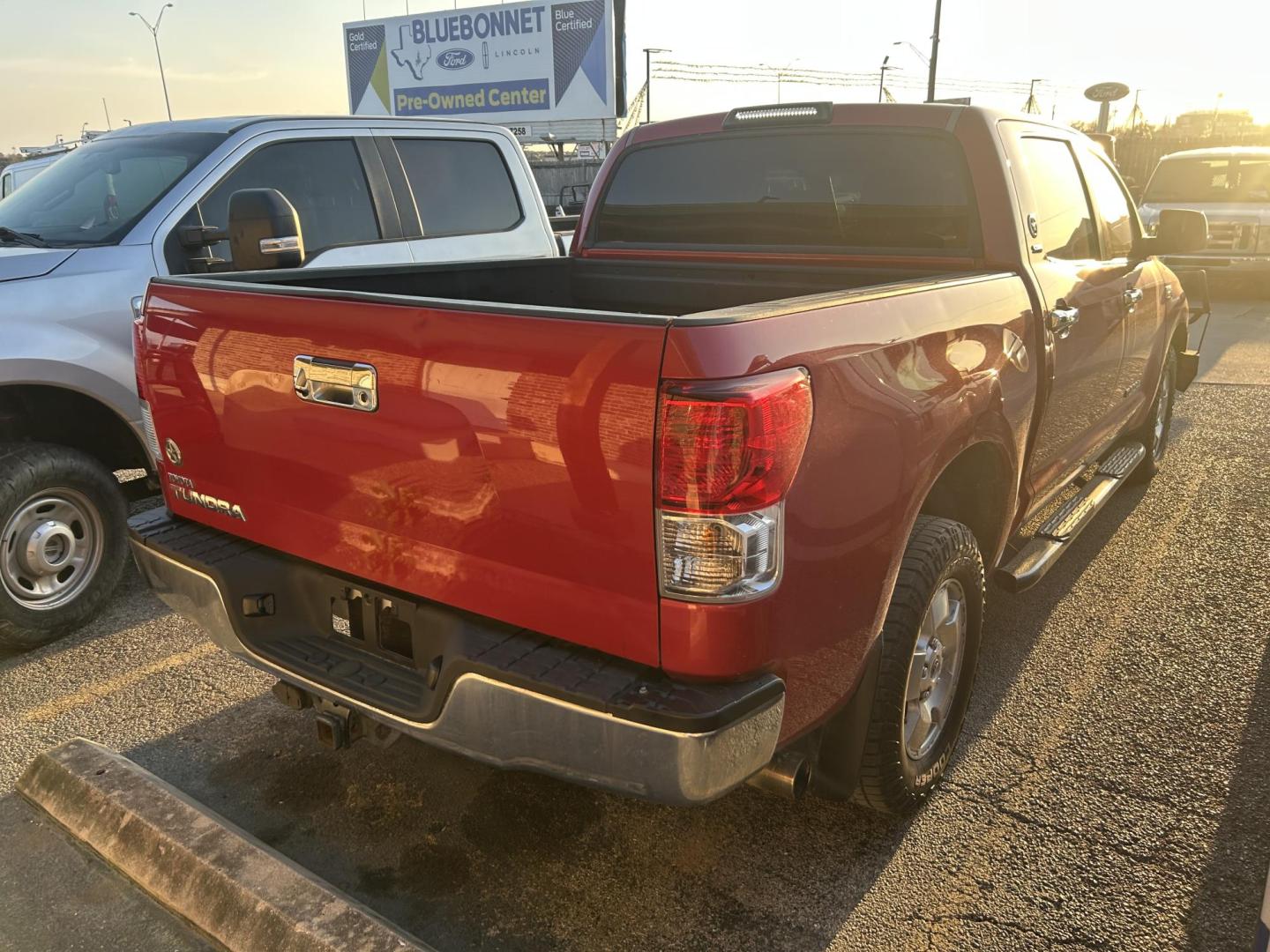 2012 Red Toyota Tundra Tundra-Grade CrewMax 5.7L 2WD (5TFEY5F14CX) with an 5.7L V8 DOHC 32V engine, 6-Speed Automatic Overdrive transmission, located at 1687 Business 35 S, New Braunfels, TX, 78130, (830) 625-7159, 29.655487, -98.051491 - Photo#2