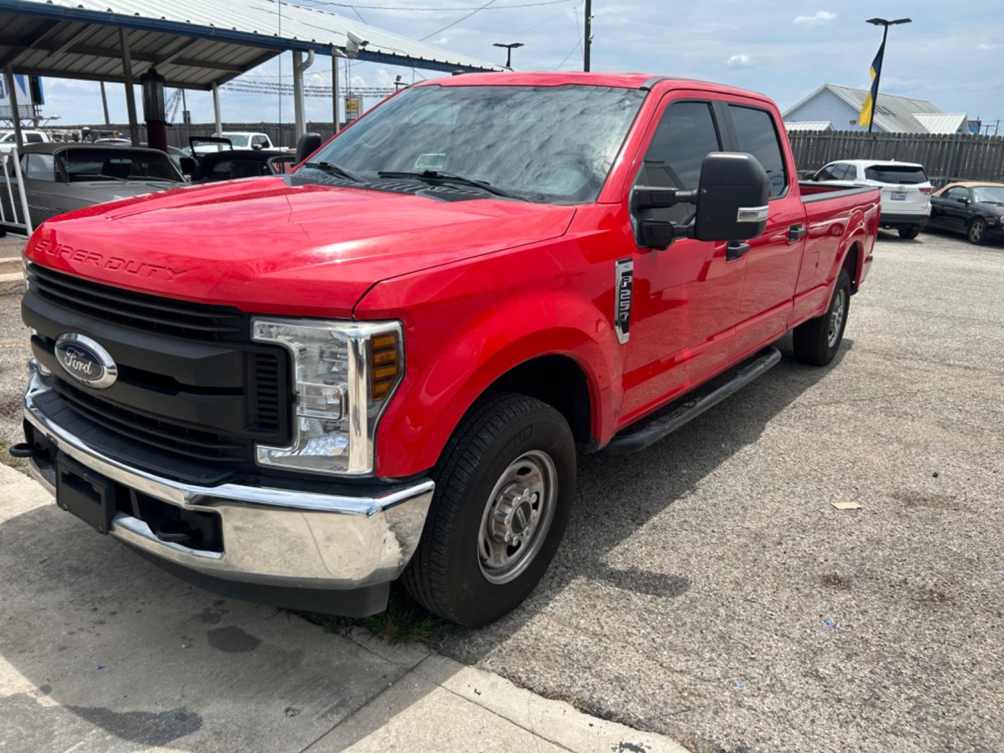 2019 Red Ford F-250 SD Lariat Crew Cab Long Bed 2WD (1FT7W2A60KE) with an 6.2L V8 OHV 16V engine, 6A transmission, located at 1687 Business 35 S, New Braunfels, TX, 78130, (830) 625-7159, 29.655487, -98.051491 - Photo#0