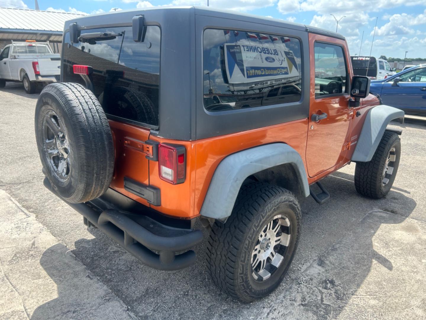 2011 Orange Jeep Wrangler Sport 4WD (1J4AA2D18BL) with an 3.8L V6 OHV 12V engine, Automatic transmission, located at 1687 Business 35 S, New Braunfels, TX, 78130, (830) 625-7159, 29.655487, -98.051491 - Photo#2