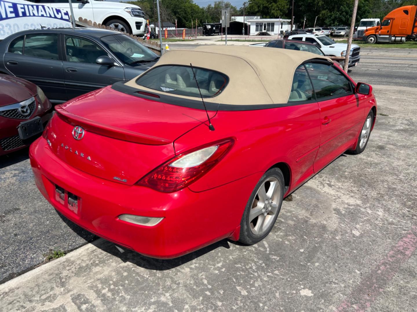 2007 Red Toyota Camry Solara SE Convertible (4T1FA38P77U) with an 3.3L V6 DOHC 24V engine, located at 1687 Business 35 S, New Braunfels, TX, 78130, (830) 625-7159, 29.655487, -98.051491 - Photo#2