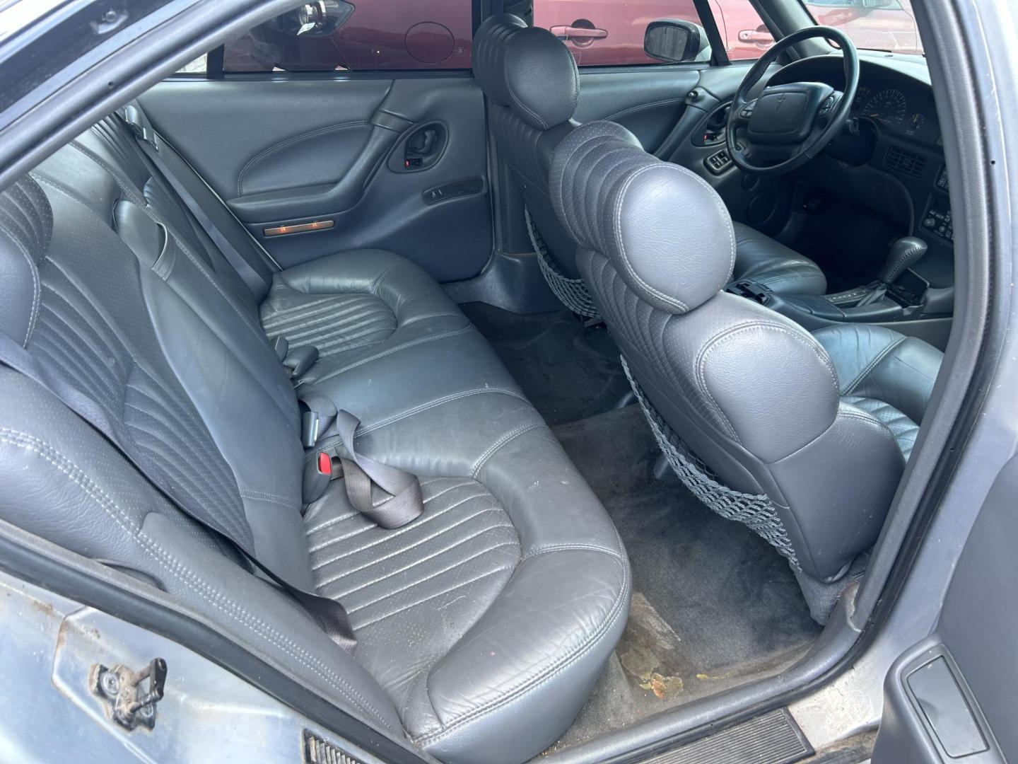 1998 Silver Pontiac Bonneville SE (1G2HX52K5WH) with an 3.8L V6 OHV 12V engine, 4-Speed Automatic Overdrive transmission, located at 1687 Business 35 S, New Braunfels, TX, 78130, (830) 625-7159, 29.655487, -98.051491 - Photo#5