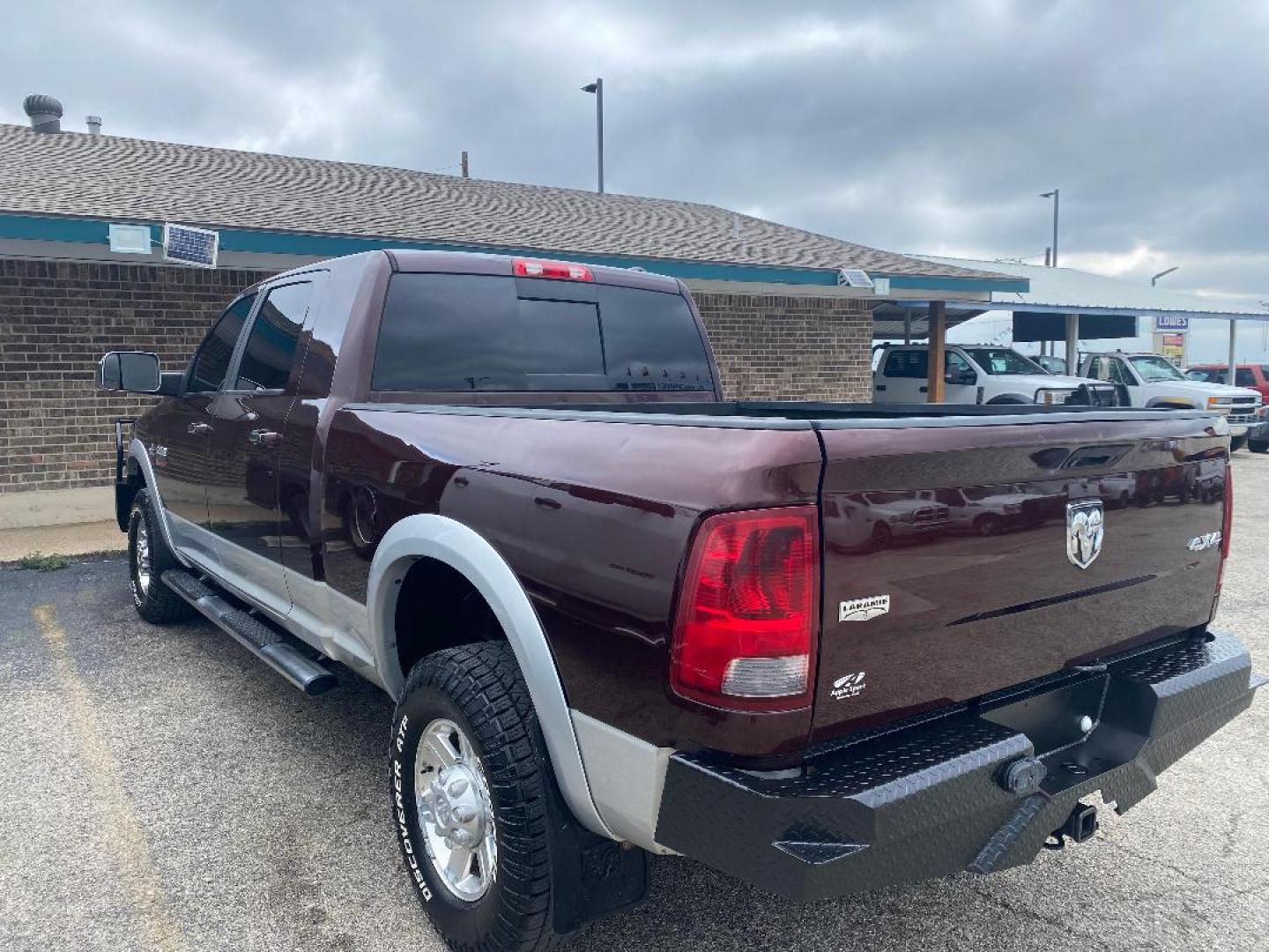 2012 Maroon /Tan Dodge Ram 3500 Laramie Mega Cab 4WD (3C63D3ML2CG) with an 6.7L L6 OHV 24V TURBO DIESEL engine, 6-Speed Automatic transmission, located at 1687 Business 35 S, New Braunfels, TX, 78130, (830) 625-7159, 29.655487, -98.051491 - Photo#1