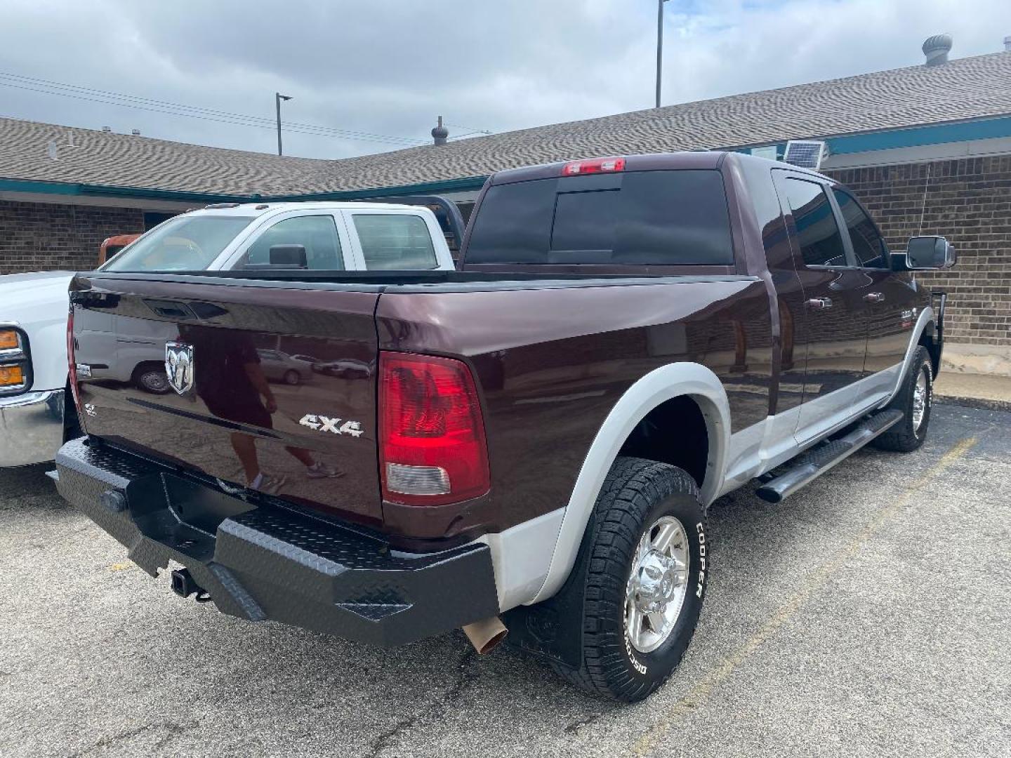 2012 Maroon /Tan Dodge Ram 3500 Laramie Mega Cab 4WD (3C63D3ML2CG) with an 6.7L L6 OHV 24V TURBO DIESEL engine, 6-Speed Automatic transmission, located at 1687 Business 35 S, New Braunfels, TX, 78130, (830) 625-7159, 29.655487, -98.051491 - Photo#2