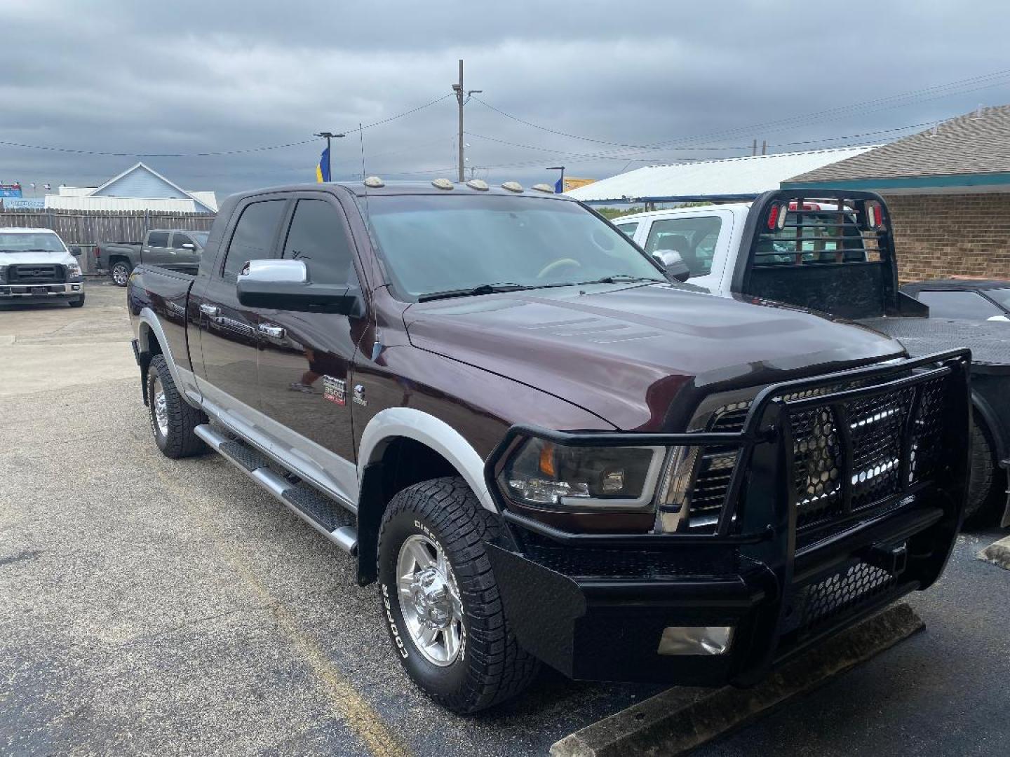 2012 Maroon /Tan Dodge Ram 3500 Laramie Mega Cab 4WD (3C63D3ML2CG) with an 6.7L L6 OHV 24V TURBO DIESEL engine, 6-Speed Automatic transmission, located at 1687 Business 35 S, New Braunfels, TX, 78130, (830) 625-7159, 29.655487, -98.051491 - Photo#3