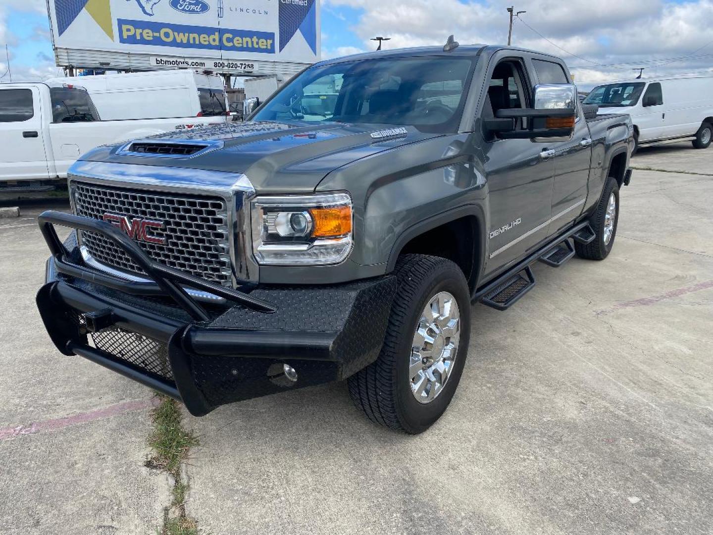 2017 Grey GMC Sierra 2500HD Denali Crew Cab 4WD (1GT12UEY3HF) with an 6.6L V8 OHV 16 DIESEL engine, 6A transmission, located at 1687 Business 35 S, New Braunfels, TX, 78130, (830) 625-7159, 29.655487, -98.051491 - Photo#0