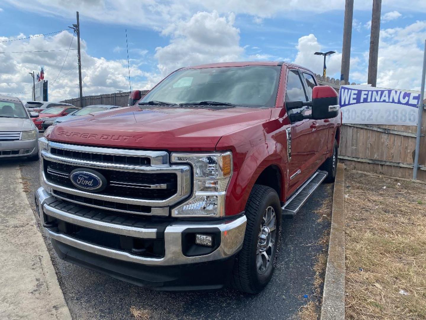 2021 Red Ford F-250 SD Lariat Crew Cab 4WD (1FT7W2BT3ME) with an 6.7L V8 OHV 16V DIESEL engine, 6A transmission, located at 1687 Business 35 S, New Braunfels, TX, 78130, (830) 625-7159, 29.655487, -98.051491 - Photo#0