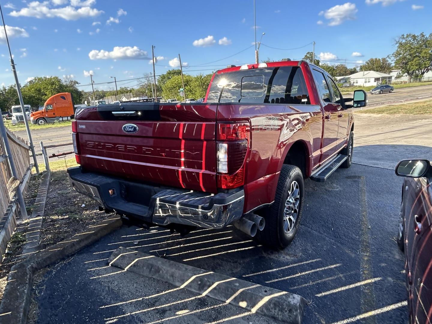 2021 Red Ford F-250 SD Lariat Crew Cab 4WD (1FT7W2BT3ME) with an 6.7L V8 OHV 16V DIESEL engine, 6A transmission, located at 1687 Business 35 S, New Braunfels, TX, 78130, (830) 625-7159, 29.655487, -98.051491 - Photo#2