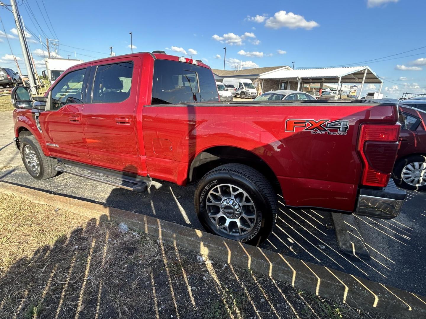 2021 Red Ford F-250 SD Lariat Crew Cab 4WD (1FT7W2BT3ME) with an 6.7L V8 OHV 16V DIESEL engine, 6A transmission, located at 1687 Business 35 S, New Braunfels, TX, 78130, (830) 625-7159, 29.655487, -98.051491 - Photo#1