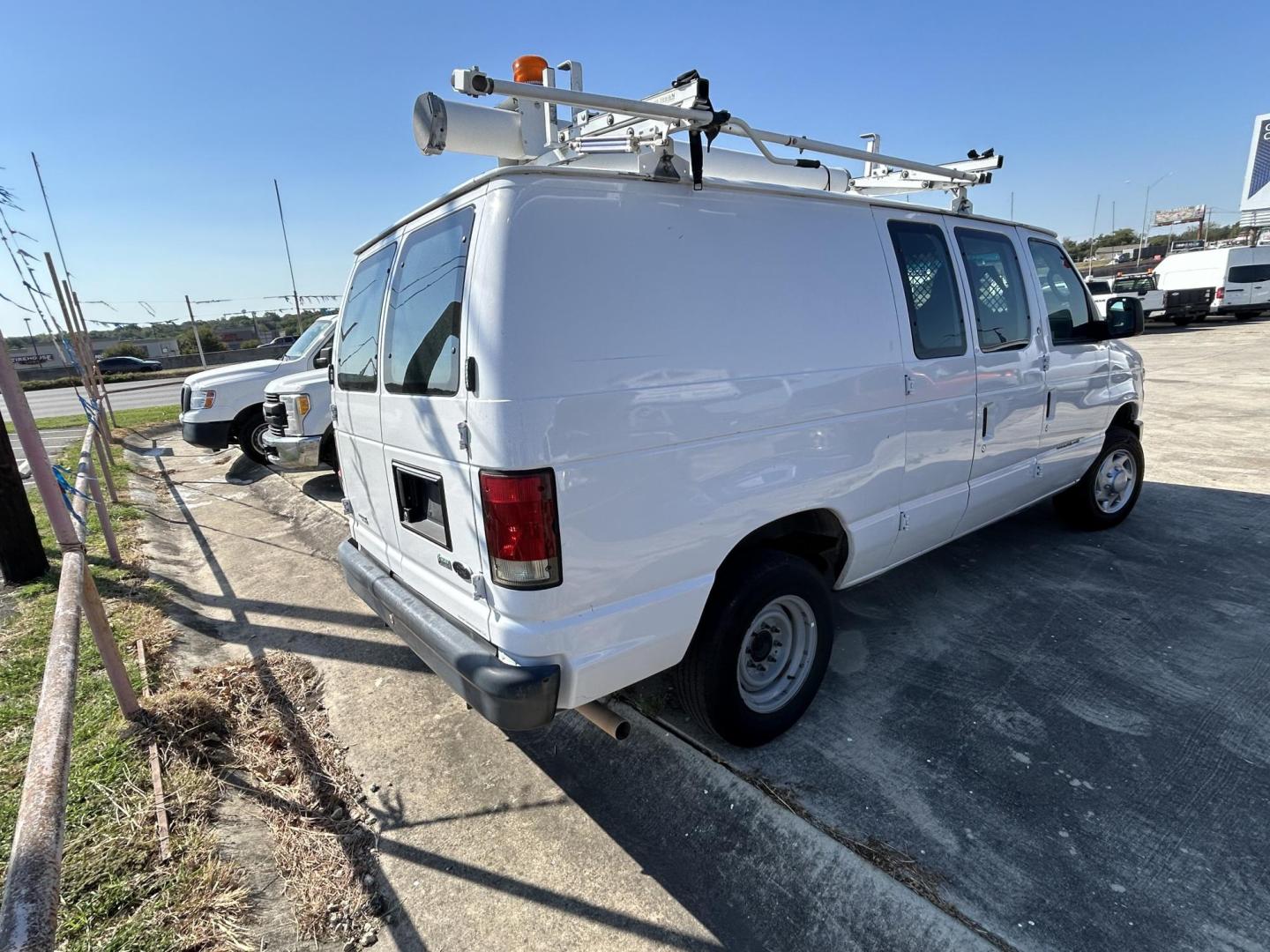 2014 White Ford E-Series Van E-150 (1FTNE1EW7ED) with an 4.6L V8 SOHC 16V engine, 4-Speed Automatic transmission, located at 1687 Business 35 S, New Braunfels, TX, 78130, (830) 625-7159, 29.655487, -98.051491 - Photo#2