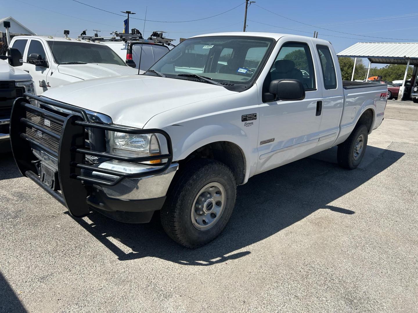 2003 White Ford F-250 SD Lariat SuperCab 4WD (1FTNX21PX3E) with an 6.0L V8 OHV 32V TURBO DIESEL engine, located at 1687 Business 35 S, New Braunfels, TX, 78130, (830) 625-7159, 29.655487, -98.051491 - Photo#0