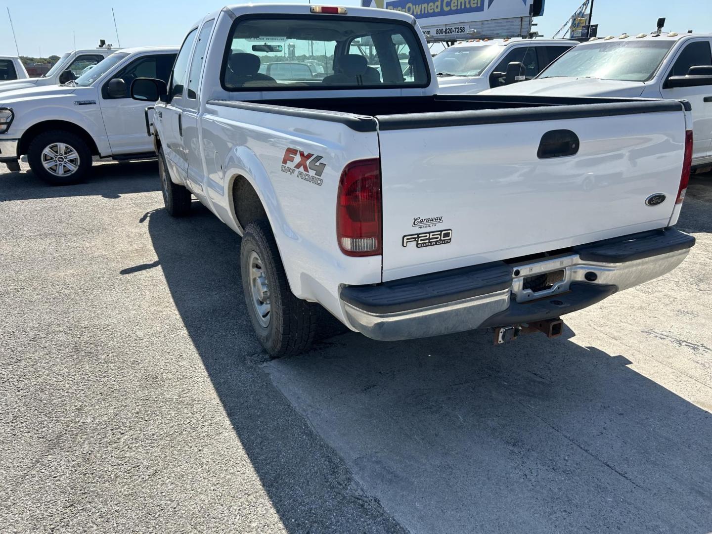 2003 White Ford F-250 SD Lariat SuperCab 4WD (1FTNX21PX3E) with an 6.0L V8 OHV 32V TURBO DIESEL engine, located at 1687 Business 35 S, New Braunfels, TX, 78130, (830) 625-7159, 29.655487, -98.051491 - Photo#1