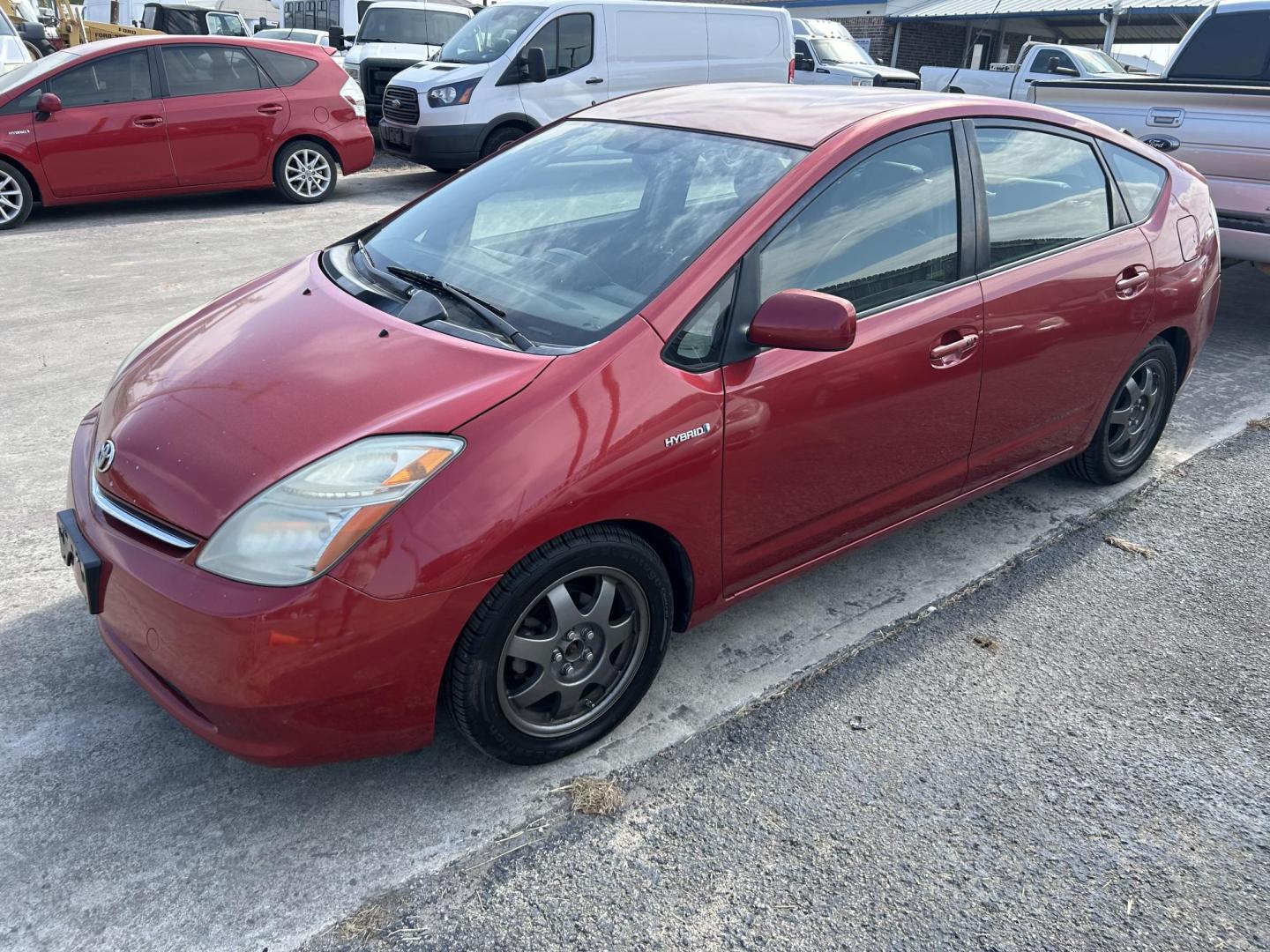 2007 Red Toyota Prius 4-Door Liftback (JTDKB20UX73) with an 1.5L L4 DOHC 16V HYBRID engine, Automatic CVT Overdrive transmission, located at 1687 Business 35 S, New Braunfels, TX, 78130, (830) 625-7159, 29.655487, -98.051491 - Photo#2