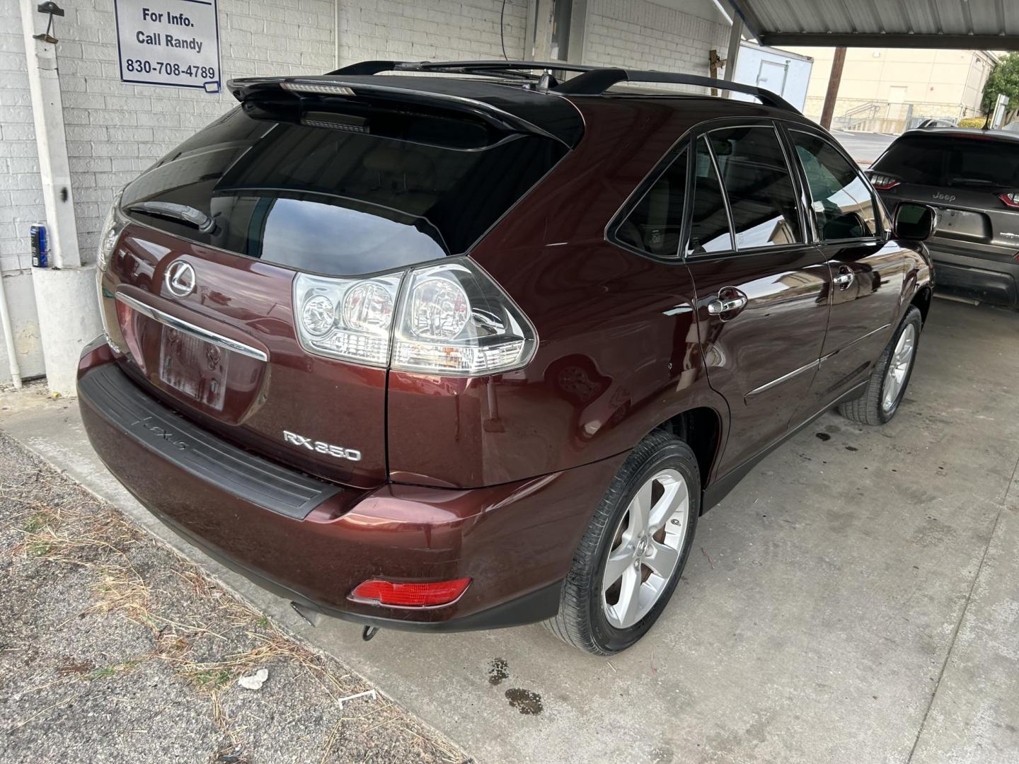 2008 Red Lexus RX 350 FWD (JTJGK31U580) with an 3.5L V6 DOHC 24V engine, 5-Speed Automatic Overdrive transmission, located at 1687 Business 35 S, New Braunfels, TX, 78130, (830) 625-7159, 29.655487, -98.051491 - Photo#2