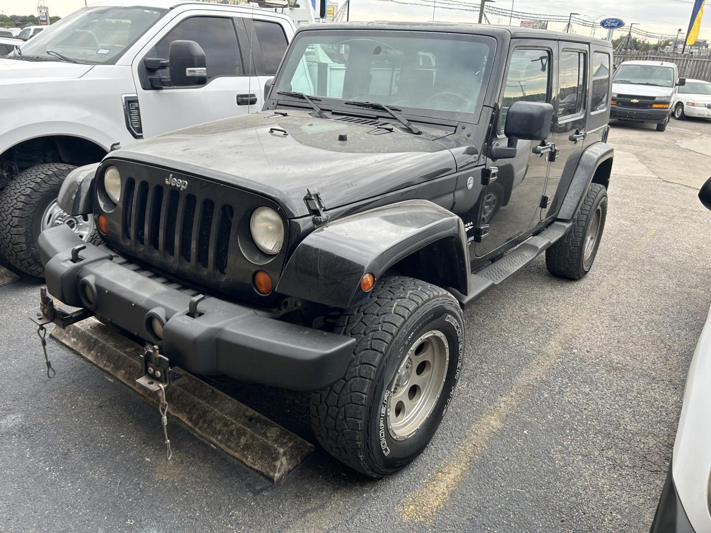 2007 Black Jeep Wrangler Unlimited Sahara 4WD (1J4GA59187L) with an 3.8L V6 OHV 12V engine, located at 1687 Business 35 S, New Braunfels, TX, 78130, (830) 625-7159, 29.655487, -98.051491 - Photo#0