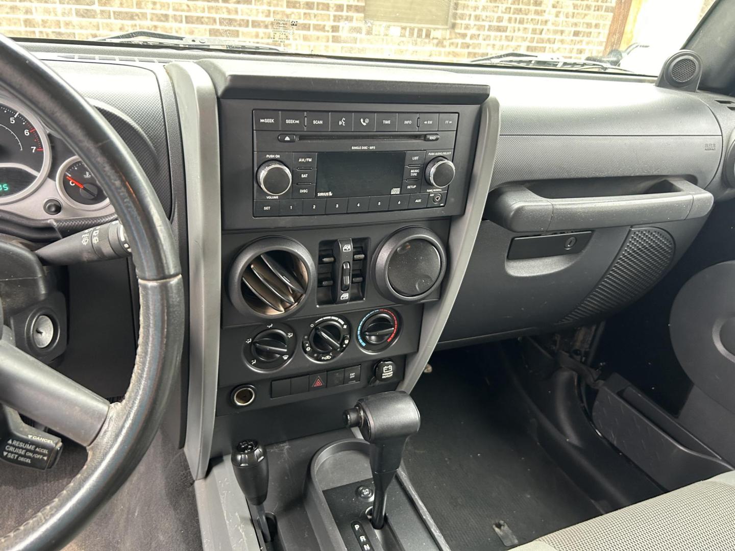 2007 Black Jeep Wrangler Unlimited Sahara 4WD (1J4GA59187L) with an 3.8L V6 OHV 12V engine, located at 1687 Business 35 S, New Braunfels, TX, 78130, (830) 625-7159, 29.655487, -98.051491 - Photo#15