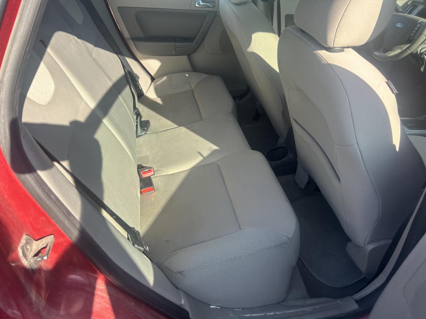 2009 Red Ford Focus SES Sedan (1FAHP36N39W) with an 2.0L L4 DOHC 16V engine, located at 1687 Business 35 S, New Braunfels, TX, 78130, (830) 625-7159, 29.655487, -98.051491 - Photo#7