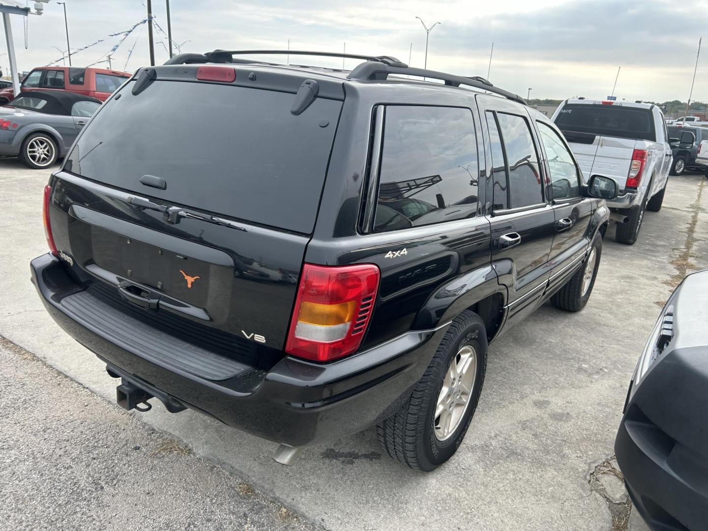 1999 Black Jeep Grand Cherokee Limited 4WD (1J4GW68NXXC) with an 4.7L V8 SOHC 16V engine, 4-Speed Automatic Overdrive transmission, located at 1687 Business 35 S, New Braunfels, TX, 78130, (830) 625-7159, 29.655487, -98.051491 - Photo#6