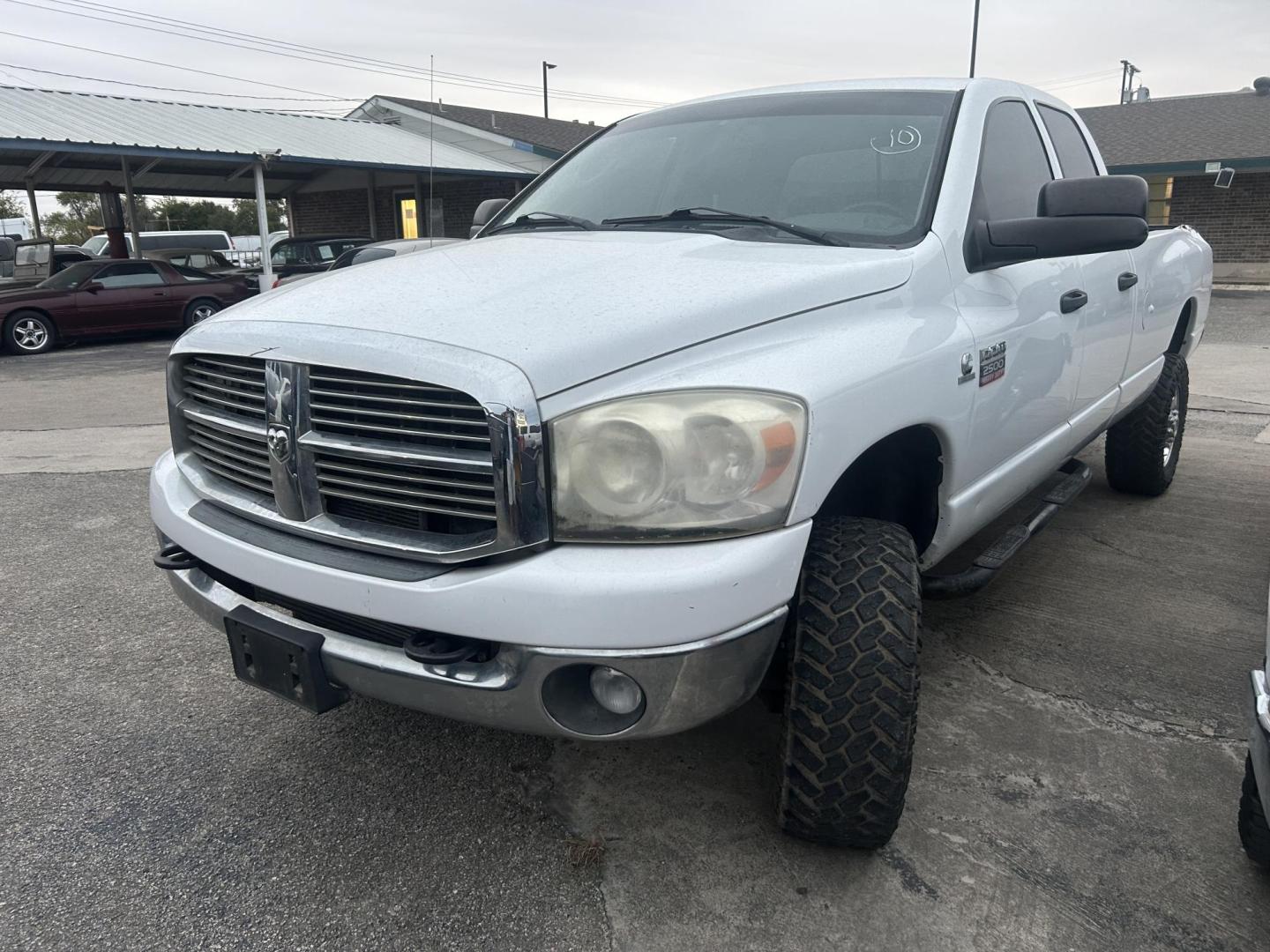 2009 White Dodge Ram 2500 Laramie Quad Cab LWB 4WD (3D7KS28L29G) with an 6.7L L6 OHV 24V TURBO DIESEL engine, located at 1687 Business 35 S, New Braunfels, TX, 78130, (830) 625-7159, 29.655487, -98.051491 - Photo#0